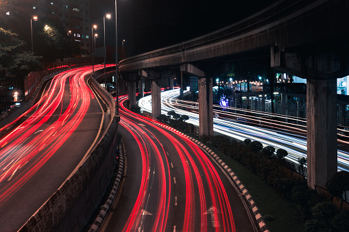 Shot with long exposure to creat light trail of moving vehicle