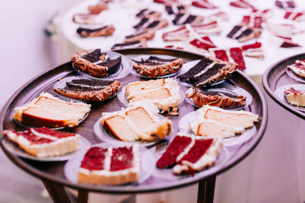 istock Sliced up wedding cake on a tray at a wedding reception. 2069814926