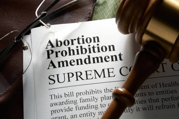 istock Abortion prohibition amendment document on binder with gavel and glasses 2069849577