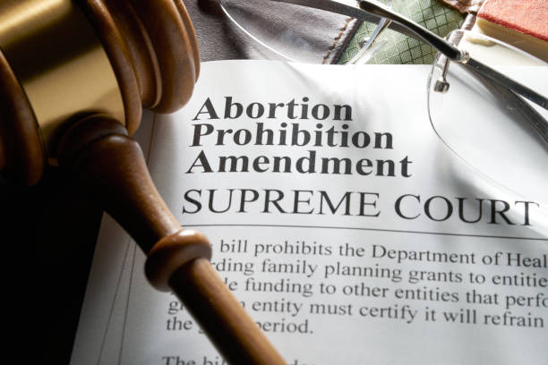 istock Abortion prohibition amendment document on binder with gavel and glasses 2069849746
