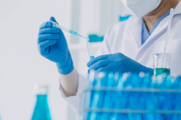 istock biochemical research scientist team working with microscope for coronavirus vaccine development in pharmaceutical research labolatory, selective focus 2069850136