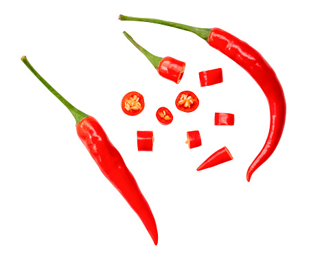 Table top view of red chili peppers in a basket with copy space