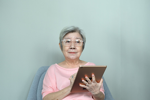 mature woman online interacting socially and  engaging in training and e-commerce
