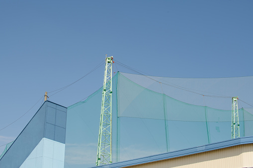 Ball protection net at golf practice range