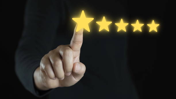 istock Man hand touching on popup five star icon for feedback review satisfaction service, Customer service experience and business satisfaction survey. best quality product and service. 2070061220