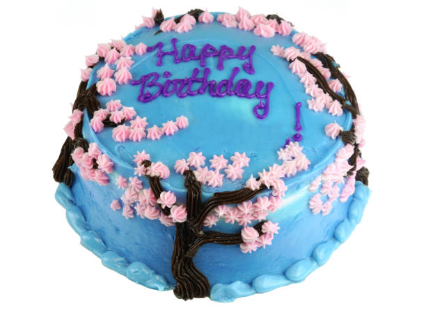 close up on fresh birthday cake with frosting cream flower