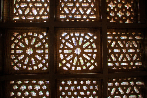 Intricate wooden lattice window design, Mandu, India
