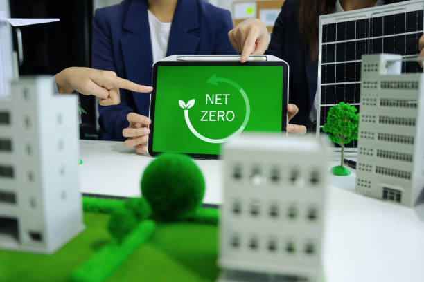 istock Business tam using tablet for working technology and business,  Renewable energy-based green businesses and global warming. Reduce CO2 emission. 2070262474