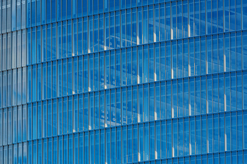Blue Glass Facade: Modern Office Building with Reflective Windows