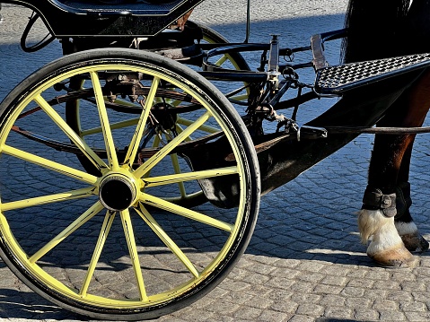 Quebec City: Old town street with view of hotel Chateau Frontenac, Champlain monument and horse buggy carriage