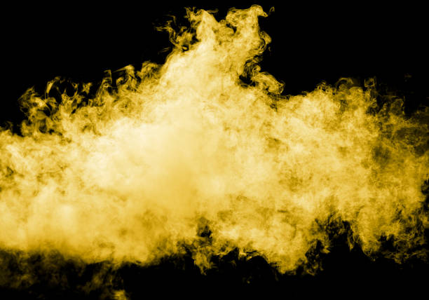 istock Yellow smoke isolated black background 2070315221