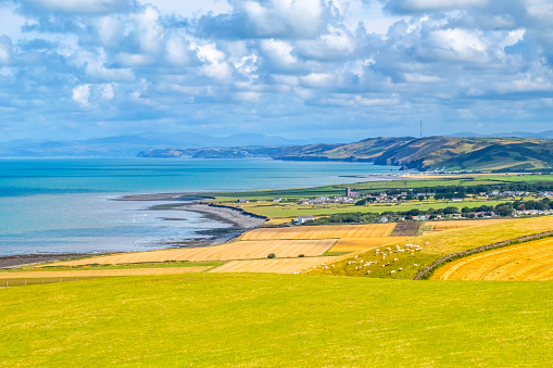 Aerial view over Ceredigion Bay with the sea and West Wales Coastline, UK.