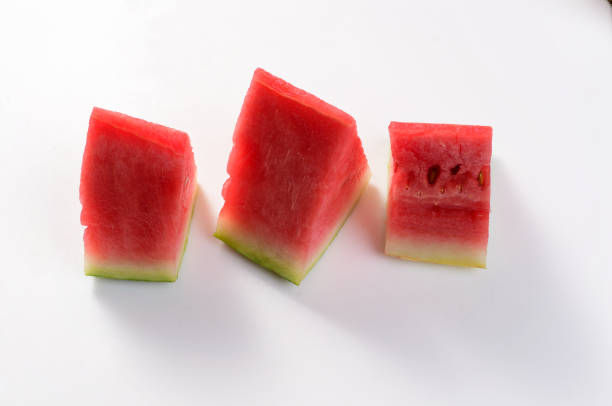 Ripe sweet watermelon served in a white background. Close up stacked photo