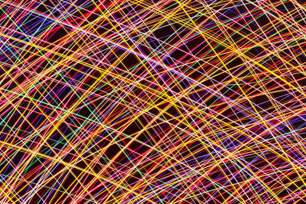 Light Trails Against Blue Sky At Night