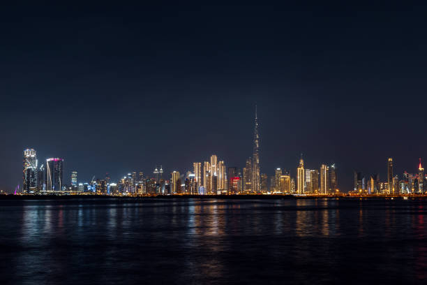 istock view of Dubai downtown cityline at night 2070351636