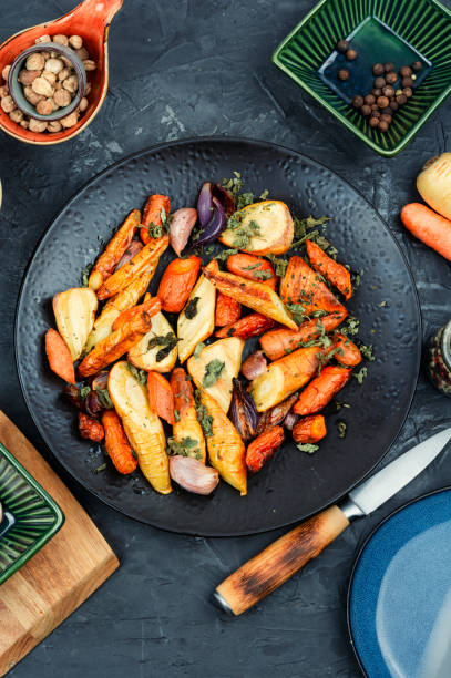 istock Roasted parsnip root and carrots. 2070358950