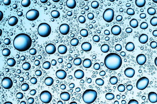 istock Water drops background. Wet glass surface texture. Winter window condensation problem. Bubble dew pattern. 2070396328