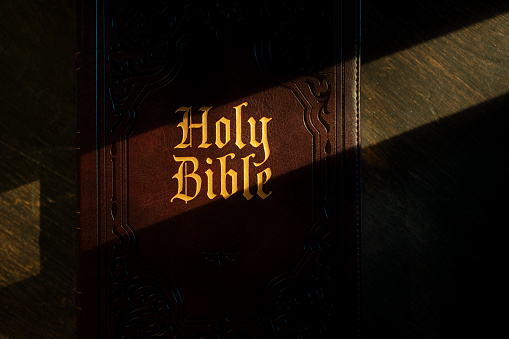 Close up of Holy Bible with golden letters on the cover