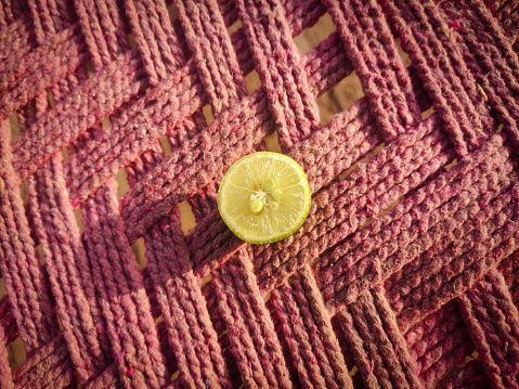 Beautiful top view of sliced lemon on Cot (background texture).