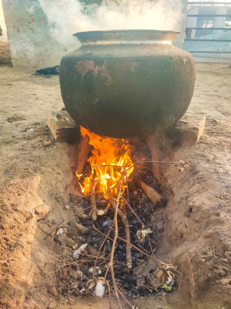 istock Pot on fire, Wood fire under the Big rice cooking pot 2070411417