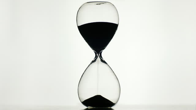 The silhouette of an hourglass on a white background