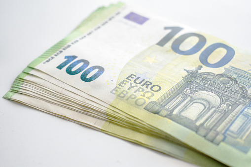 100 Euro banknotes money on the table. Savings for the future concepts.