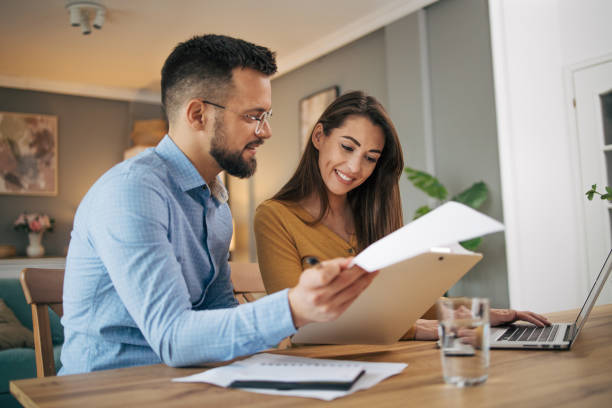 istock Busy couple working with finance in dining room 2070548413