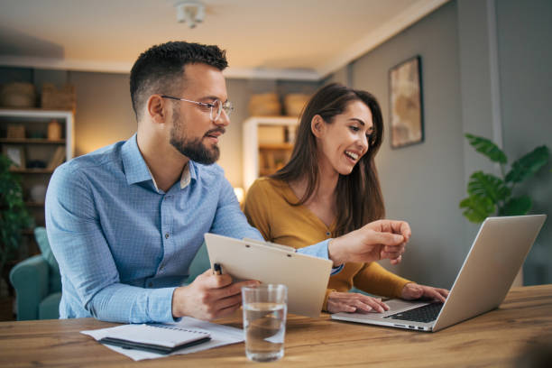 istock Busy couple working with finance in dining room 2070549445