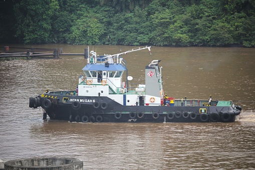 Samarinda,Indonesia - January 20, 2018 : coal tugboat passing through the mahakam river
