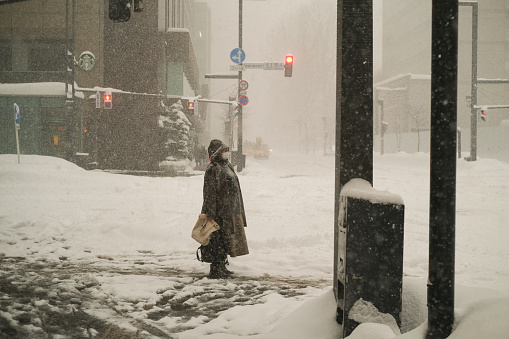 A pedestrian in Sapporo during blizzard