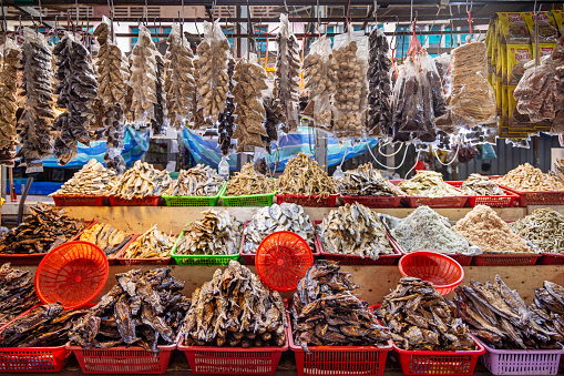 Lantau, Hong Kong - January 3, 2020: Dried fish hanging for sale on the streets of Tai O fishing village in Hong Kong