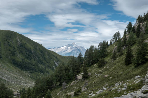 The peaks and glacier are outlined between the mountains when hiking in Switzerland