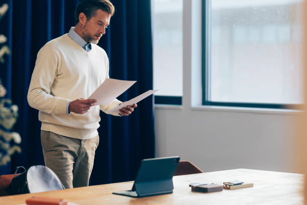 istock Confident Businessman Giving Presentation in Modern Office Space 2070679177