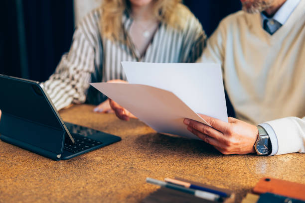istock Professional Colleagues Reviewing Documents Together at Workplace 2070679202