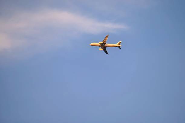 istock Commercial plane in the blue sky at sunset. 2070684471