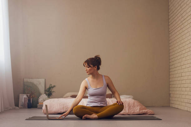 istock Young Woman Practicing Yoga in a Serene Home Environment 2070690766