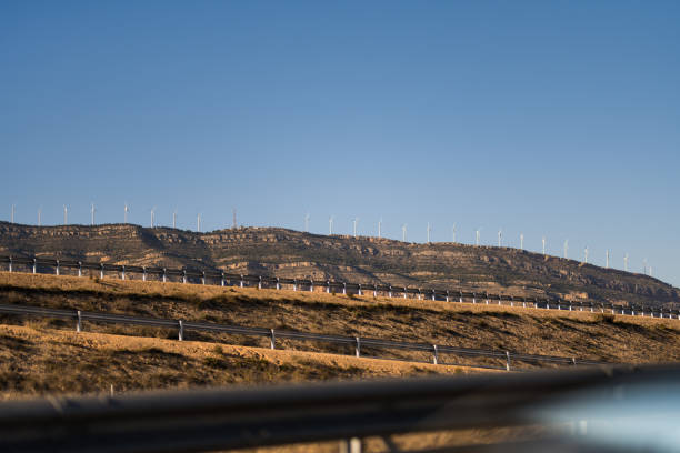 Wind turbines collecting wind energy in Spain. Sustainability and renewable energy.