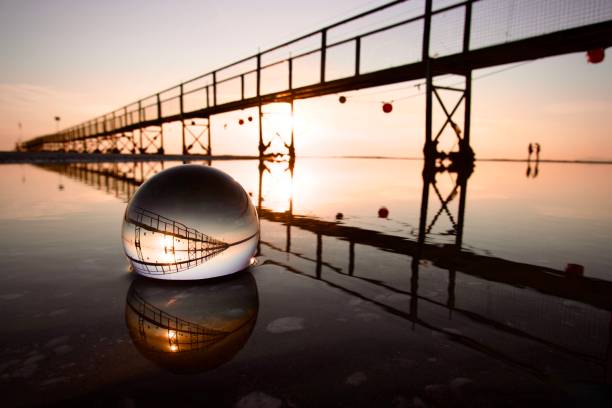 Crystal ball at beach during dawn