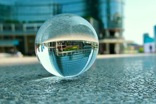 Crystal ball against skyscrapers