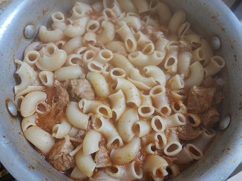 Pasta cooked with plenty of liquid tomato sauce, oil, beef and spices in the Libyan-Egyptian style, also known as mabakbaka. Libyan cuisine, Egyptian cuisine, Mediterranean food
