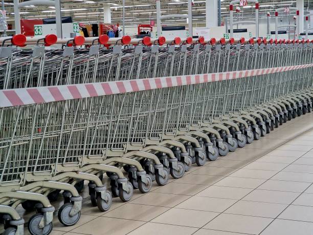 istock grocery carts stand in a supermarket 2070798520