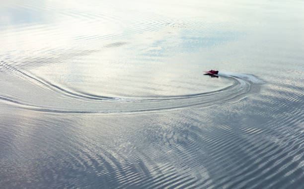 istock A small plastic boat floats on the surface of the water 2070803779