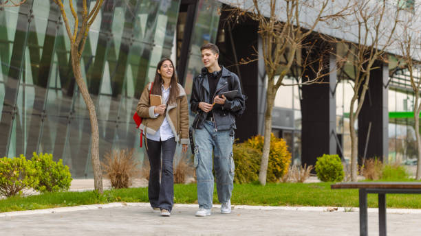 istock Young students walking in the park 2070851451