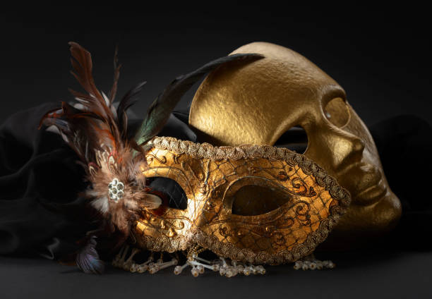istock Golden Venetian carnival masks on a black background. 2070869798