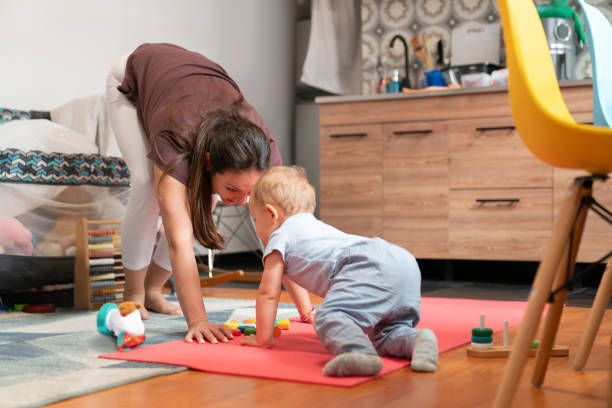 istock Loving mother playing with her child at home 2070871940