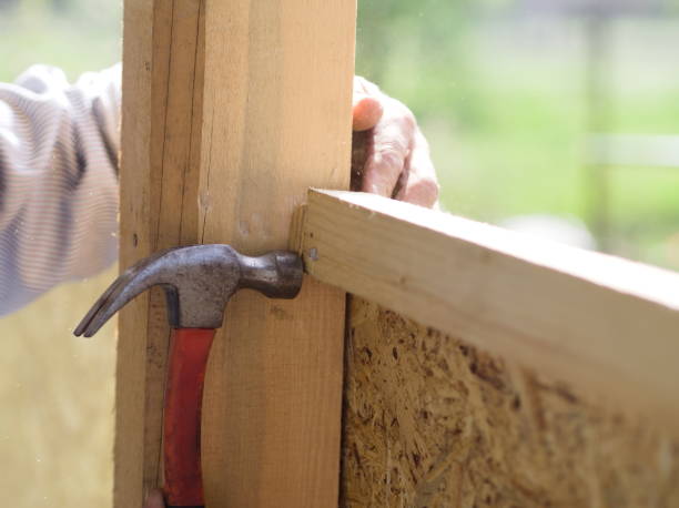 istock Carpenter's hand hammering a nail 2070899491