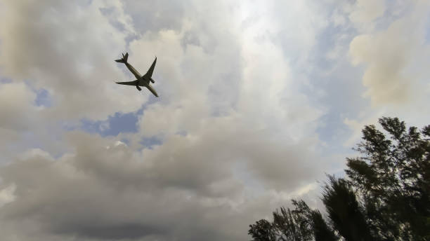 istock large aircraft landing behind a cloudy sky 2070910535