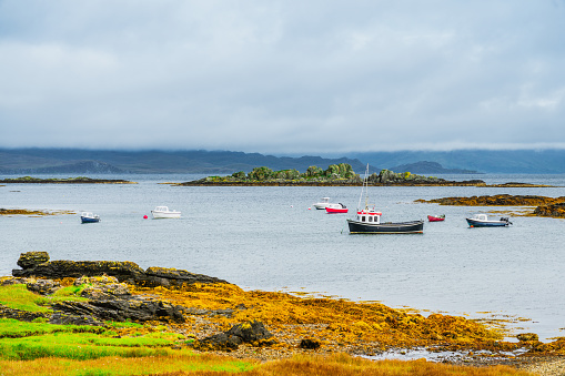 Sailing yachts and fishing boats at their moorings at Isle of Skye