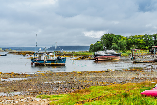 Sailing yachts and fishing boats at their moorings at Isle of Skye