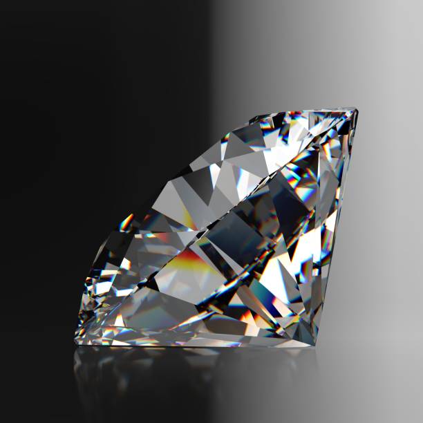 istock Round brilliant cut diamond, close up side view on black and white gradient background 2070926206